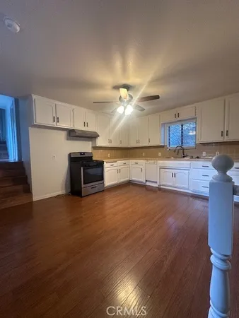 a view of kitchen with wooden floor