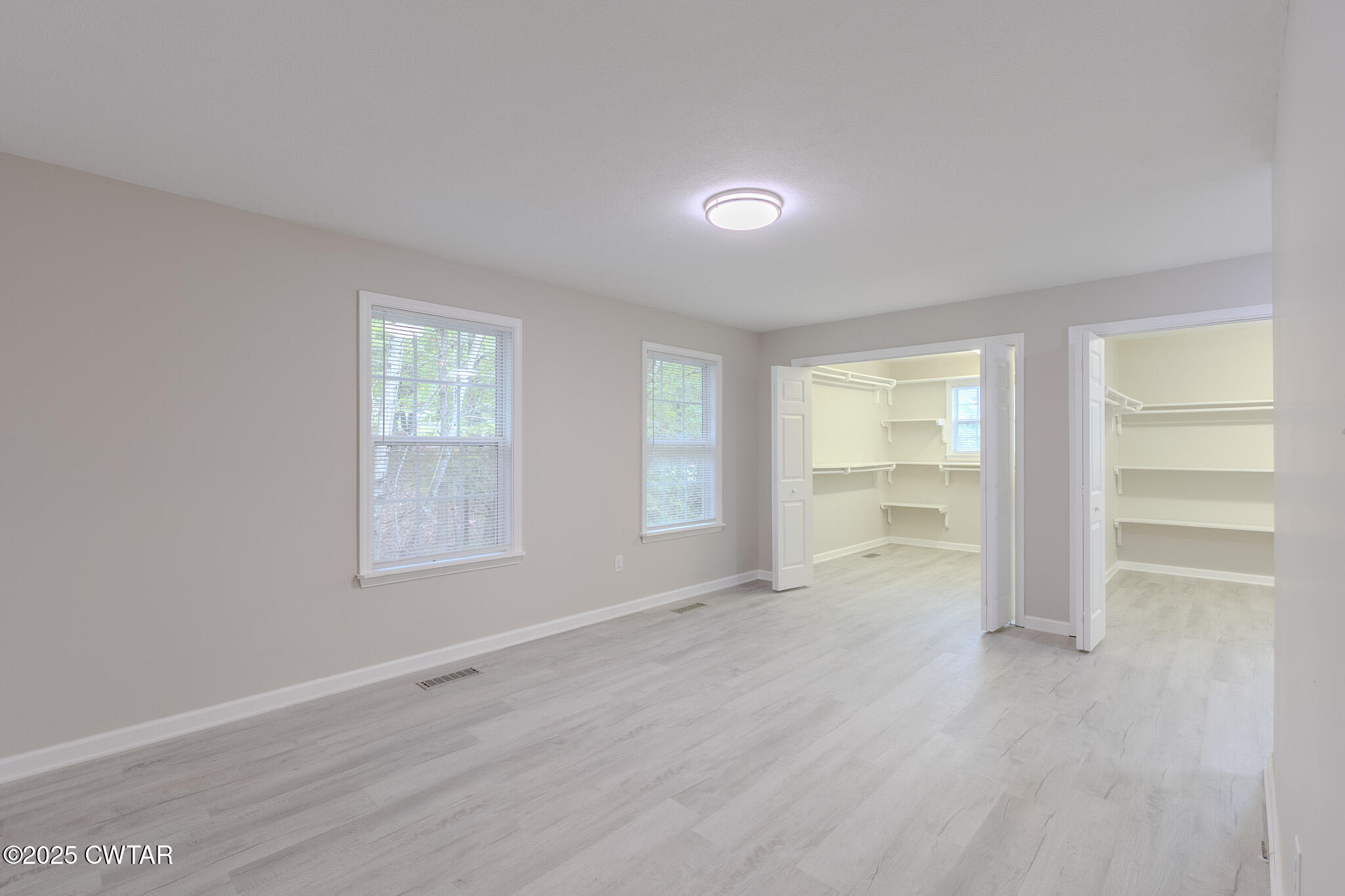 2850 Jeanette Holladay Road Parsons, TN 38363 - Photo 14 of 40 wooden floor in an empty room with a window
