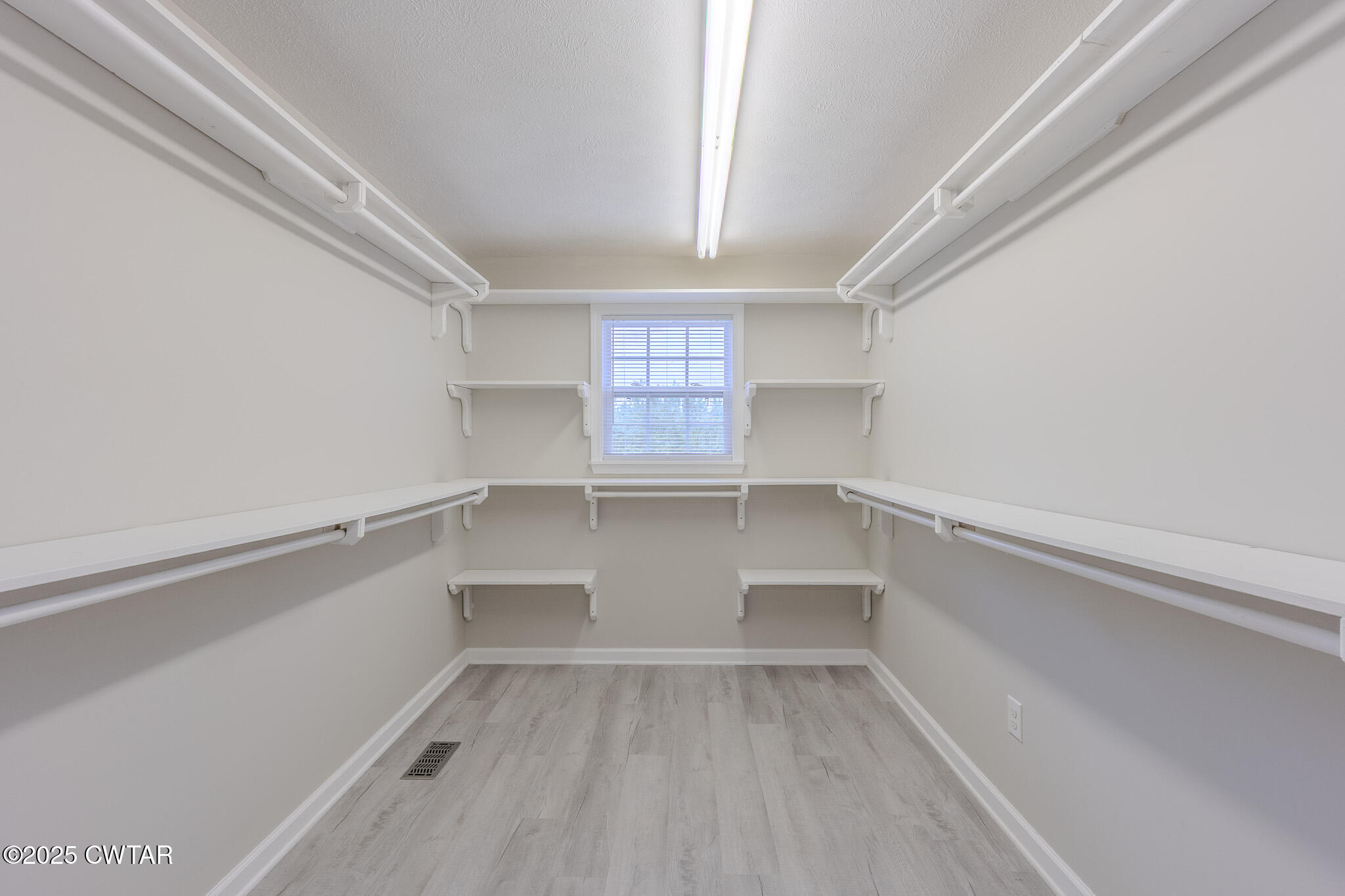 2850 Jeanette Holladay Road Parsons, TN 38363 - Photo 17 of 40 a view of walk in closet with empty racks