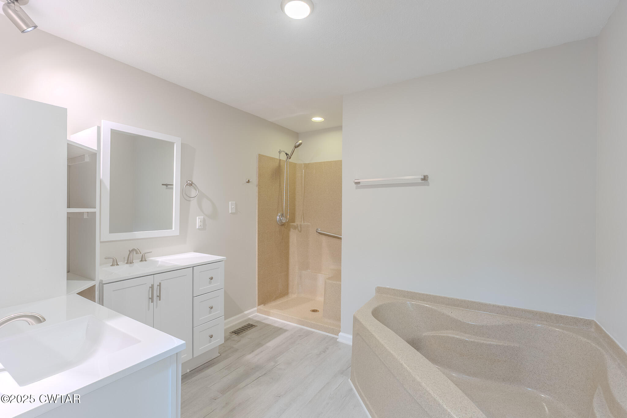 2850 Jeanette Holladay Road Parsons, TN 38363 - Photo 18 of 40 a bathroom with a tub sink and mirror