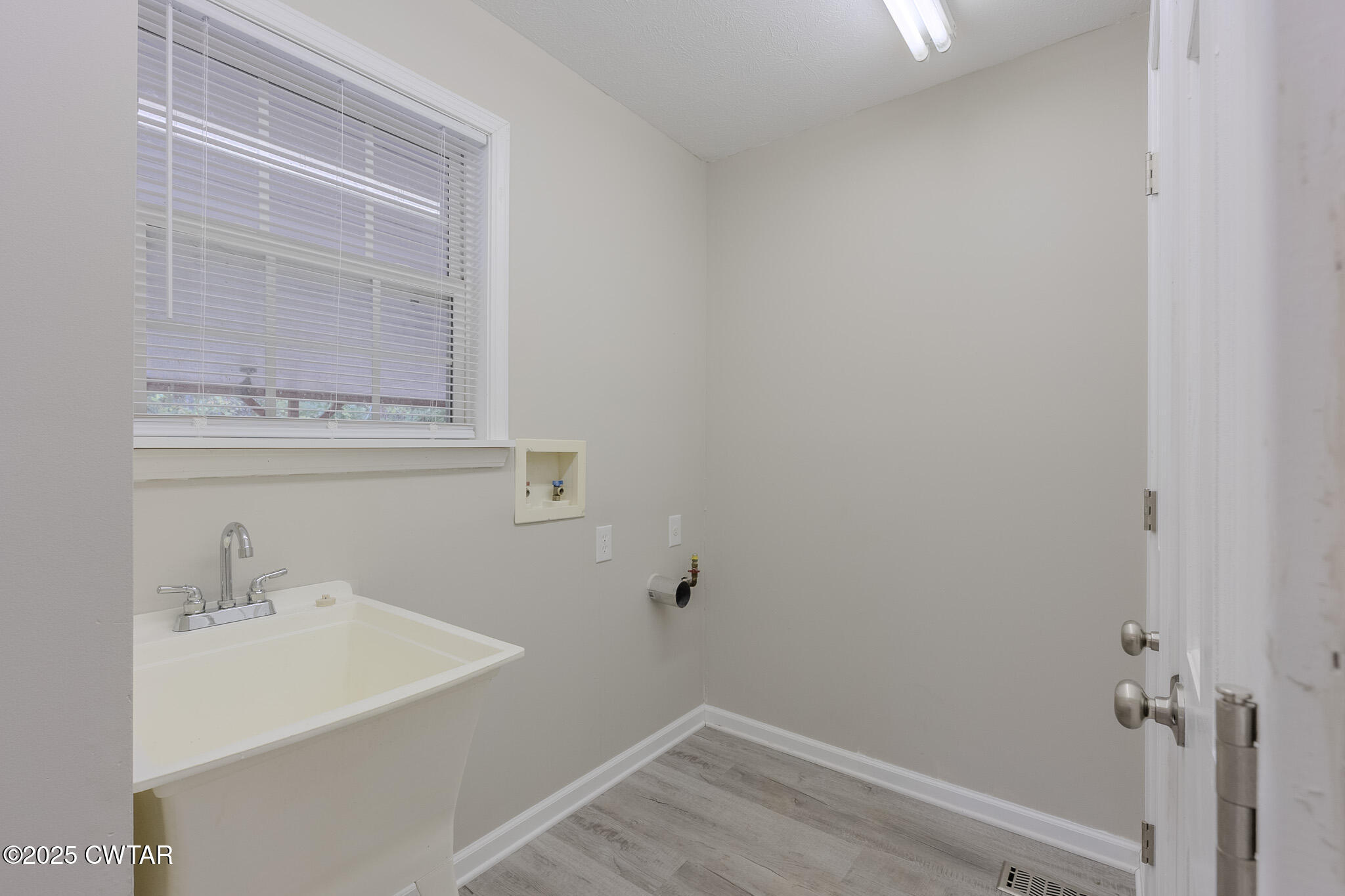 2850 Jeanette Holladay Road Parsons, TN 38363 - Photo 24 of 40 a bathroom with a sink and mirror