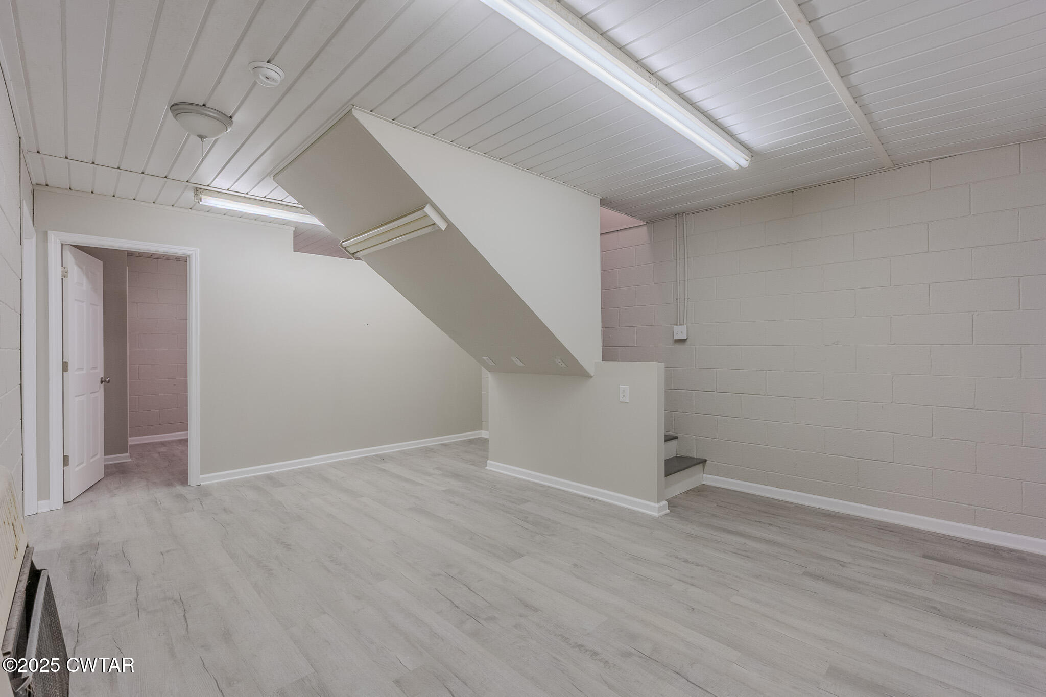 2850 Jeanette Holladay Road Parsons, TN 38363 - Photo 25 of 40 an empty room with wooden floor and entryway