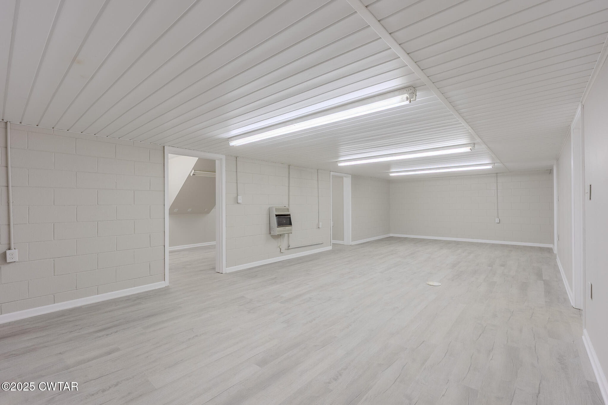 2850 Jeanette Holladay Road Parsons, TN 38363 - Photo 28 of 40 an empty room with wooden floor and windows