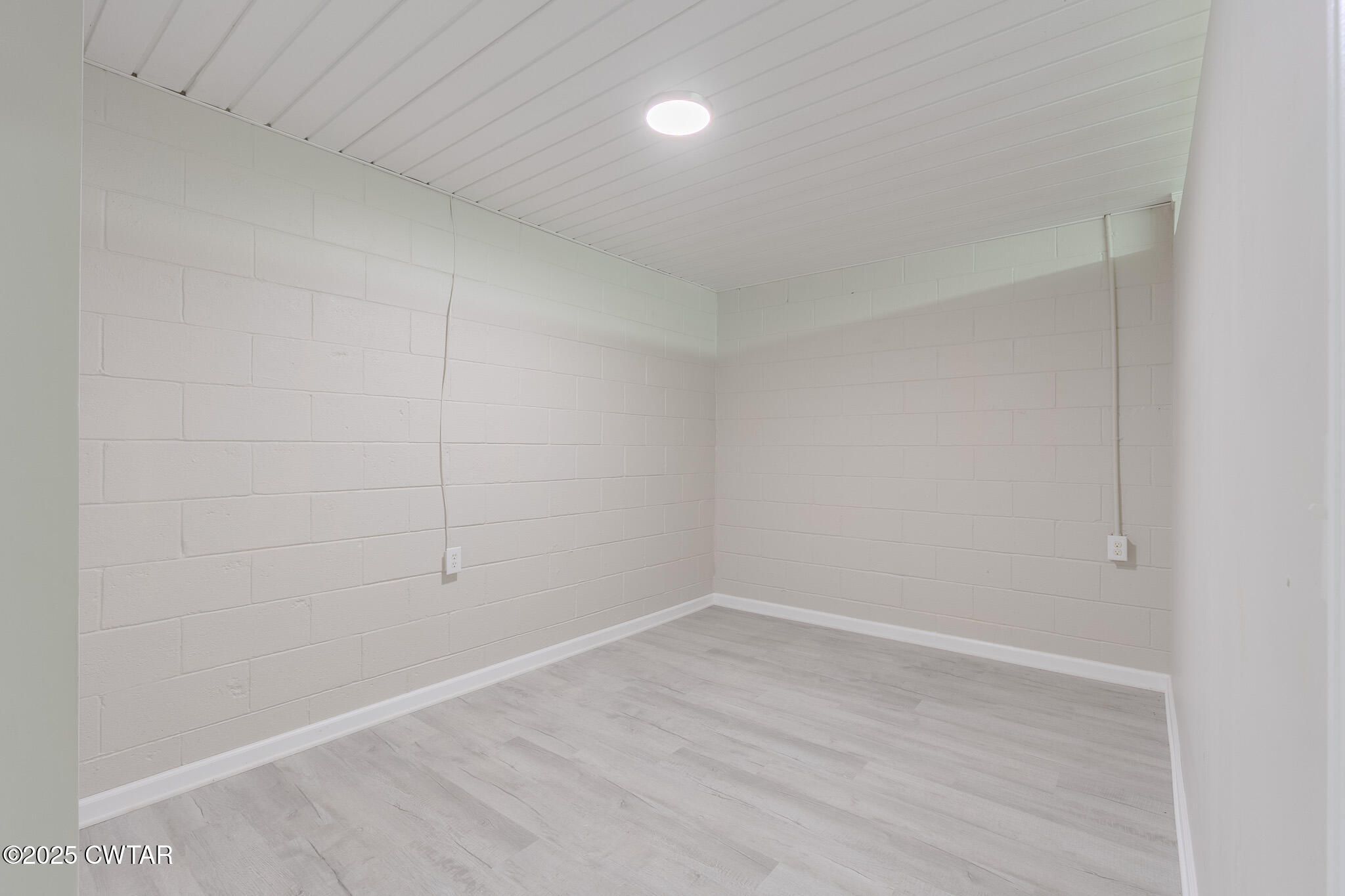 2850 Jeanette Holladay Road Parsons, TN 38363 - Photo 30 of 40 a view of an empty room with wooden floor