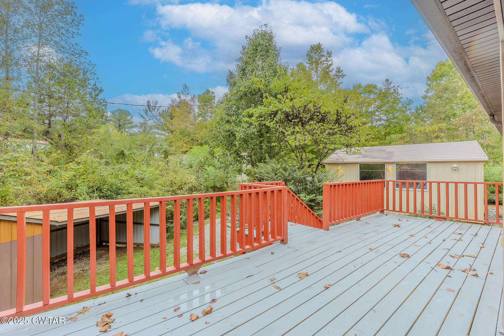 2850 Jeanette Holladay Road Parsons, TN 38363 - Photo 34 of 40 a balcony with wooden floor and yard in the back