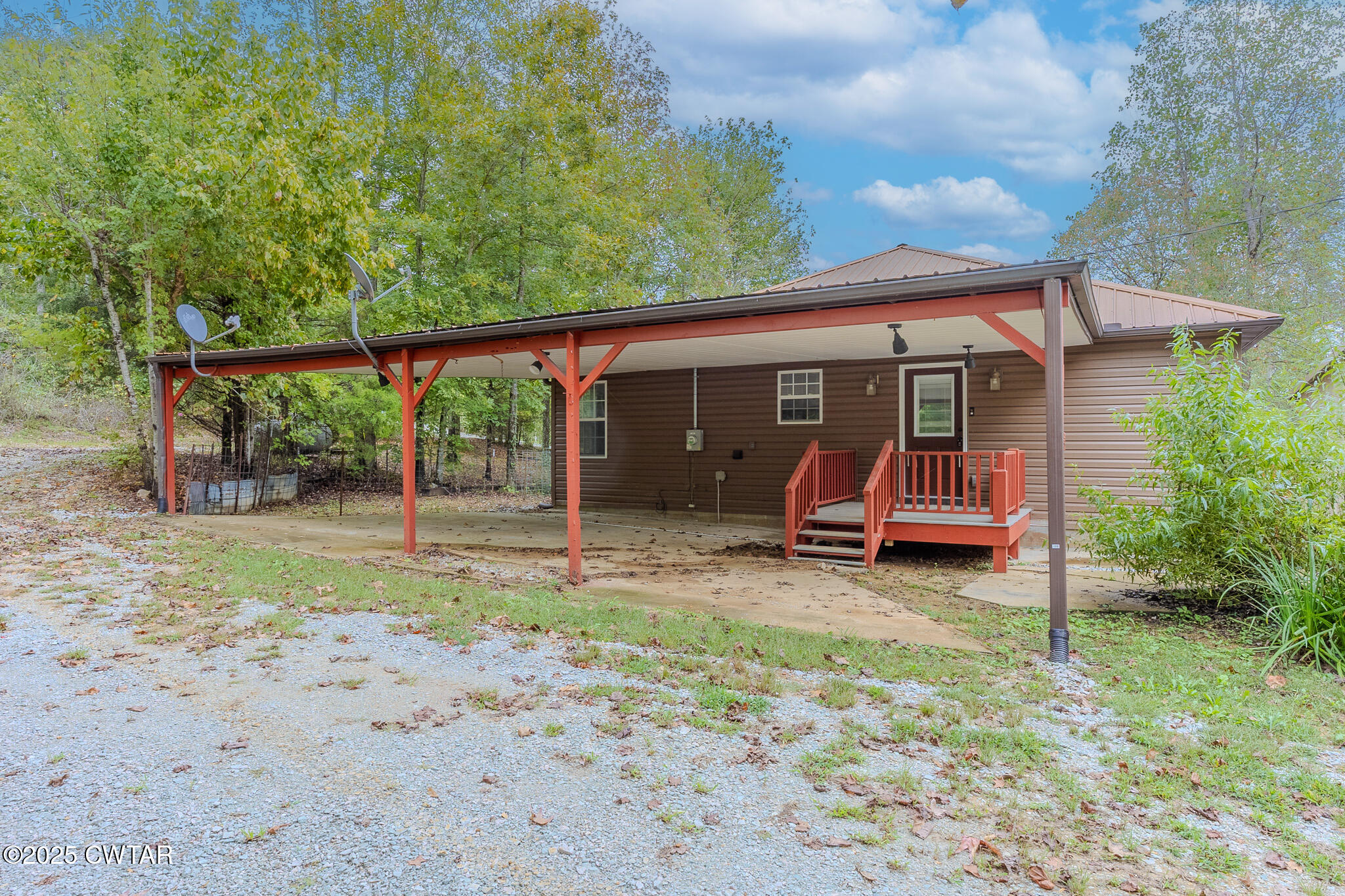2850 Jeanette Holladay Road Parsons, TN 38363 - Photo 36 of 40 a view of a chair and table in backyard of the house