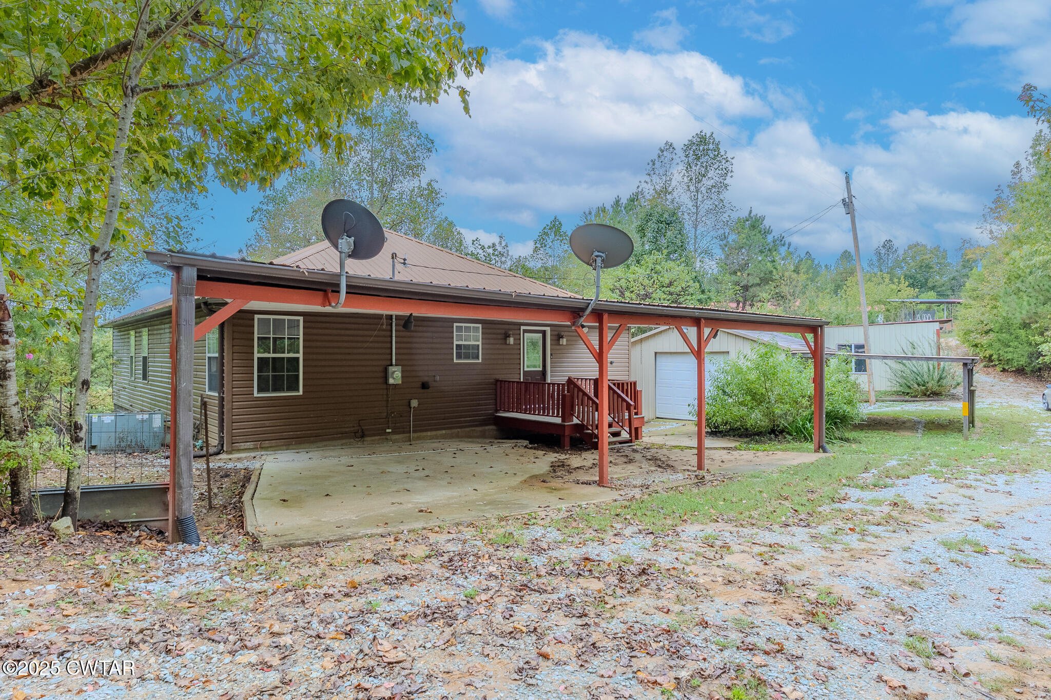 2850 Jeanette Holladay Road Parsons, TN 38363 - Photo 37 of 40 a view of a house with a yard and furniture