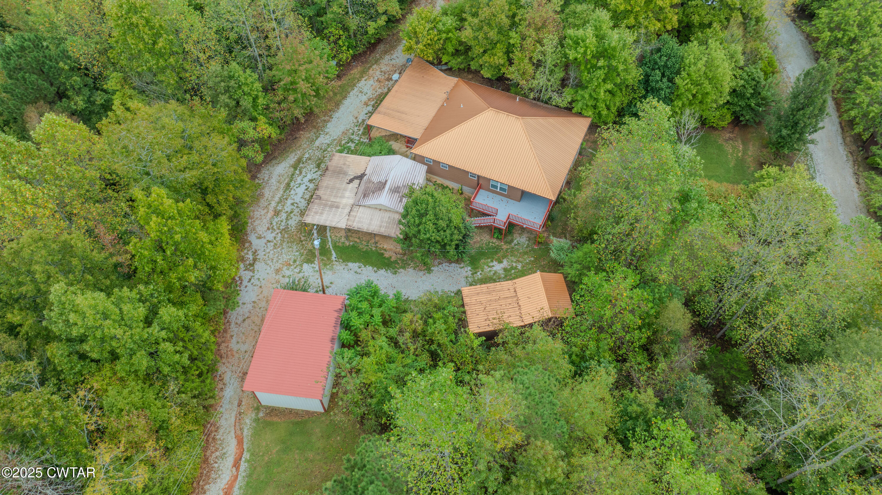 2850 Jeanette Holladay Road Parsons, TN 38363 - Photo 38 of 40 an aerial view of a house with outdoor space and street view