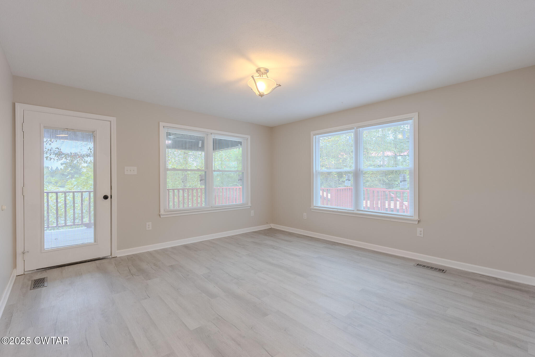 2850 Jeanette Holladay Road Parsons, TN 38363 - Photo 9 of 40 a view of an empty room with a window