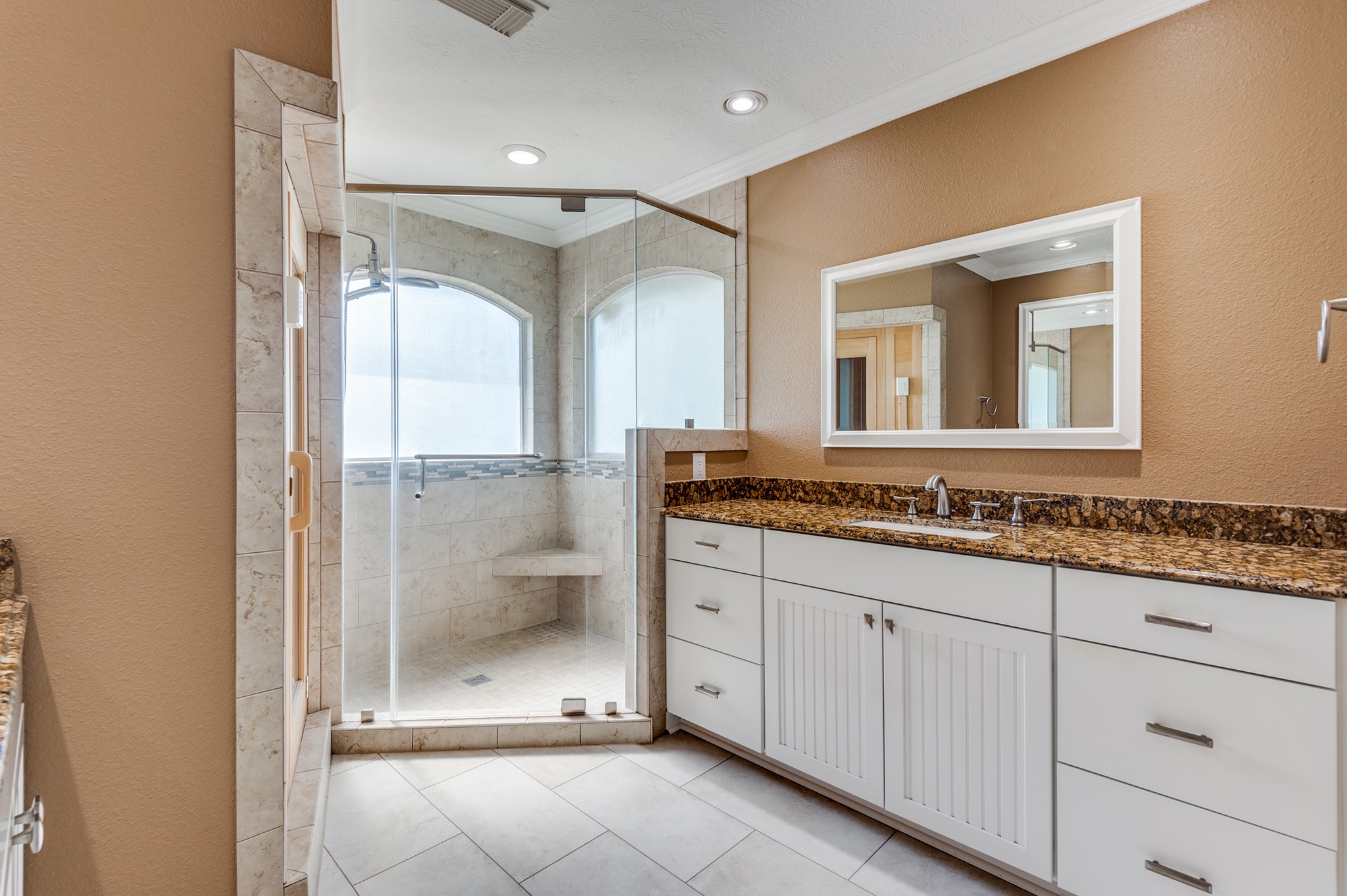 341 Sam Houston Loop Point Blank, TX 77364 - Photo 16 of 36 a bathroom with a granite countertop sink mirror and double