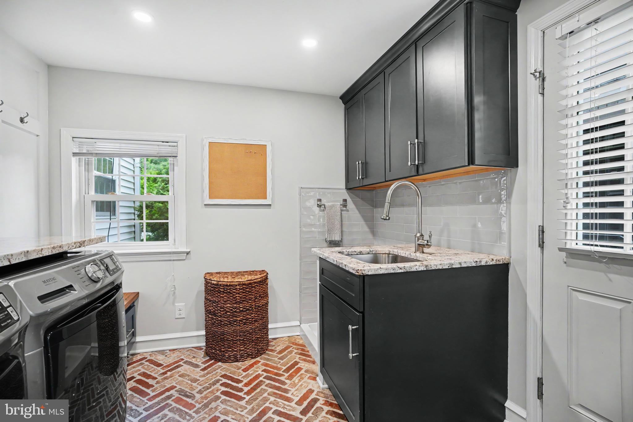 235 Hopkins Road Haddonfield, NJ 08033 - Photo 24 of 47 a kitchen with a sink stove and cabinets