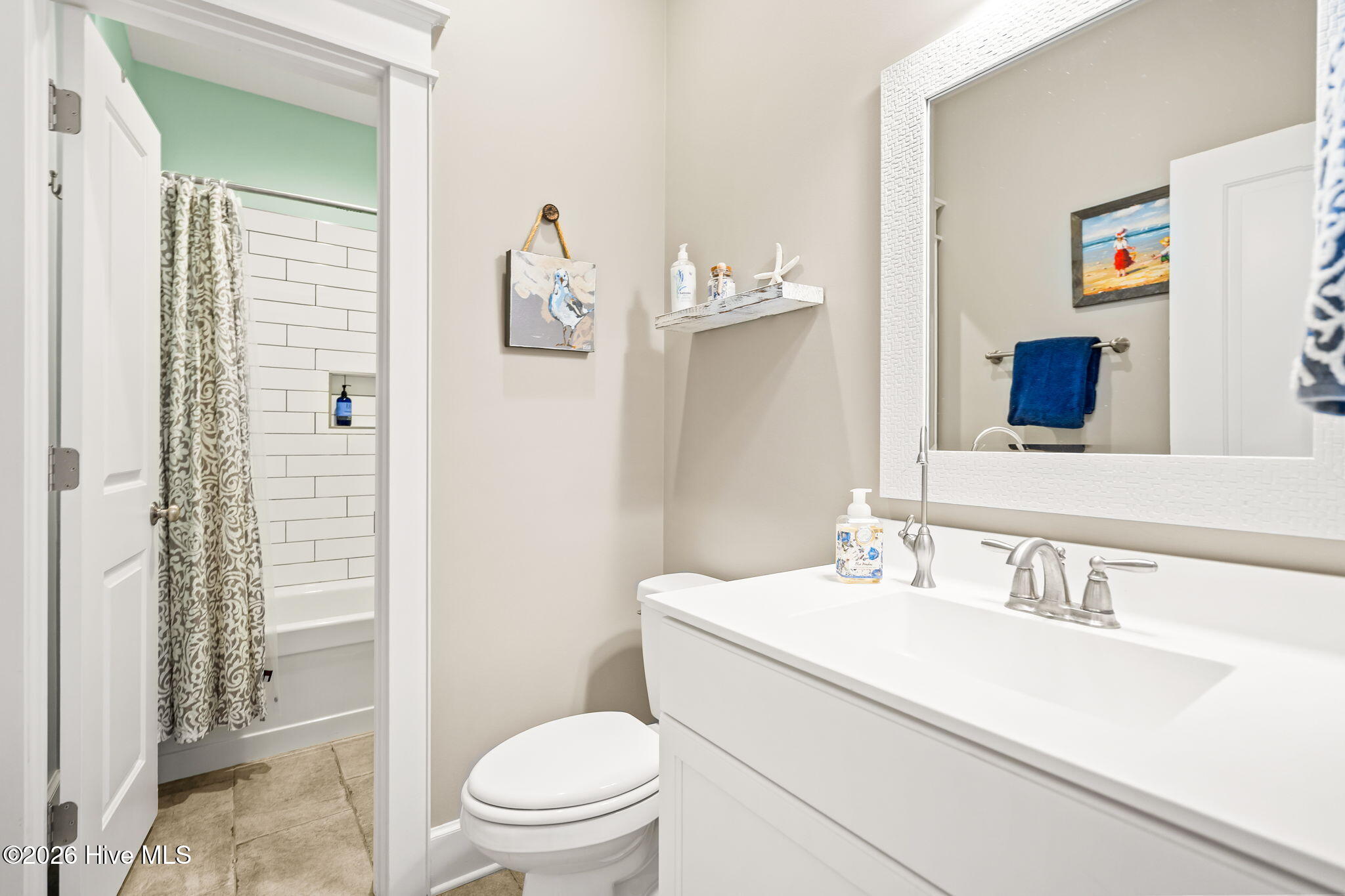 211 Whimbrel Way Hampstead, NC 28443 - Photo 50 of 99 Each bath upstairs has its own toilet and vanity and shares a bathtub shower in between