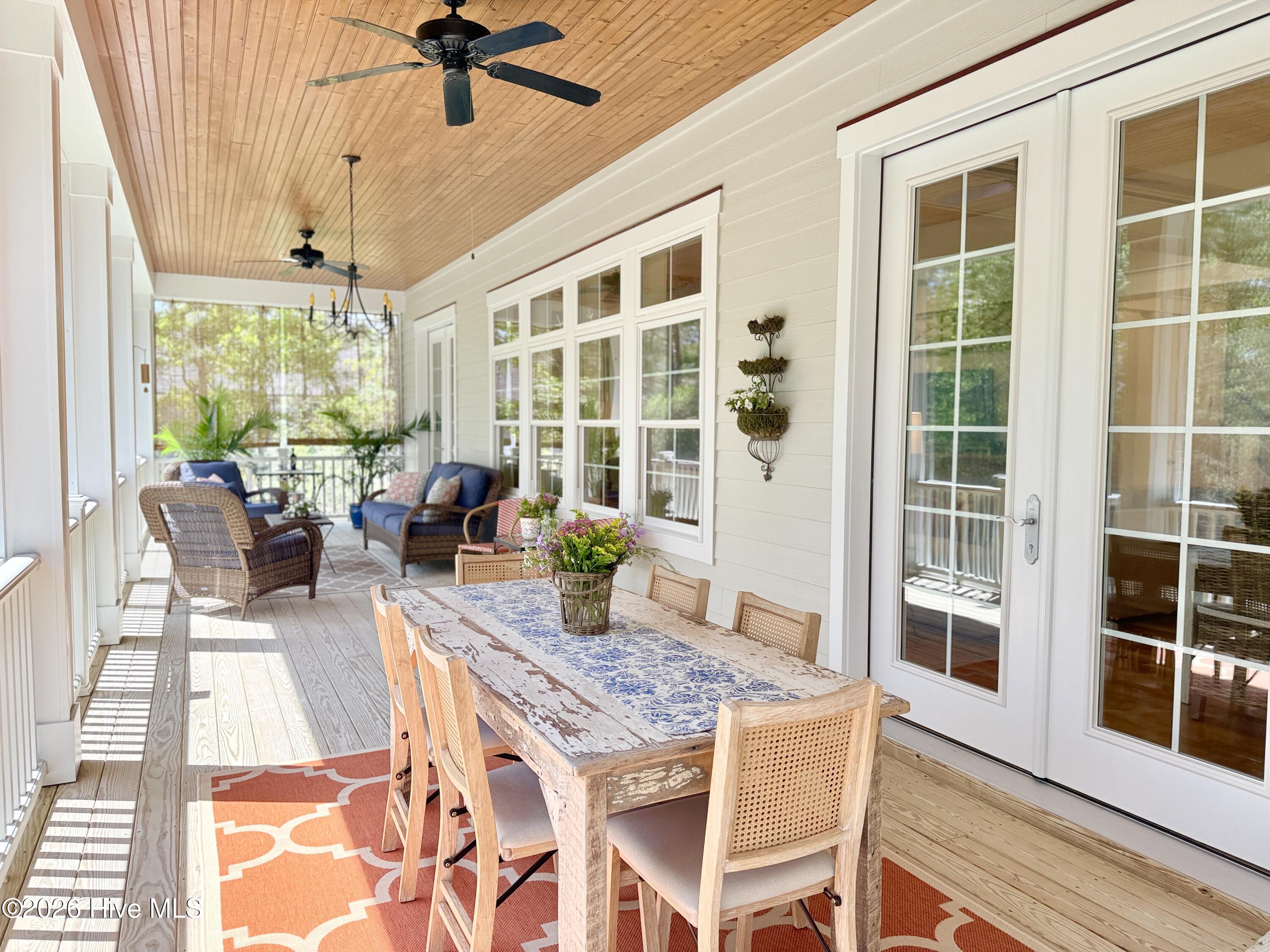 211 Whimbrel Way Hampstead, NC 28443 - Photo 55 of 99 Huge screened porch spans entire length of the house