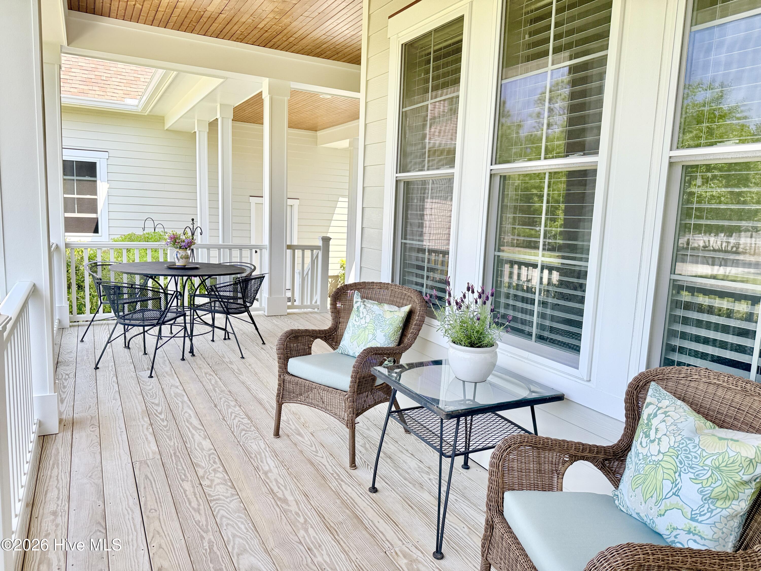 211 Whimbrel Way Hampstead, NC 28443 - Photo 57 of 99 Front porch has multiple gathering spaces