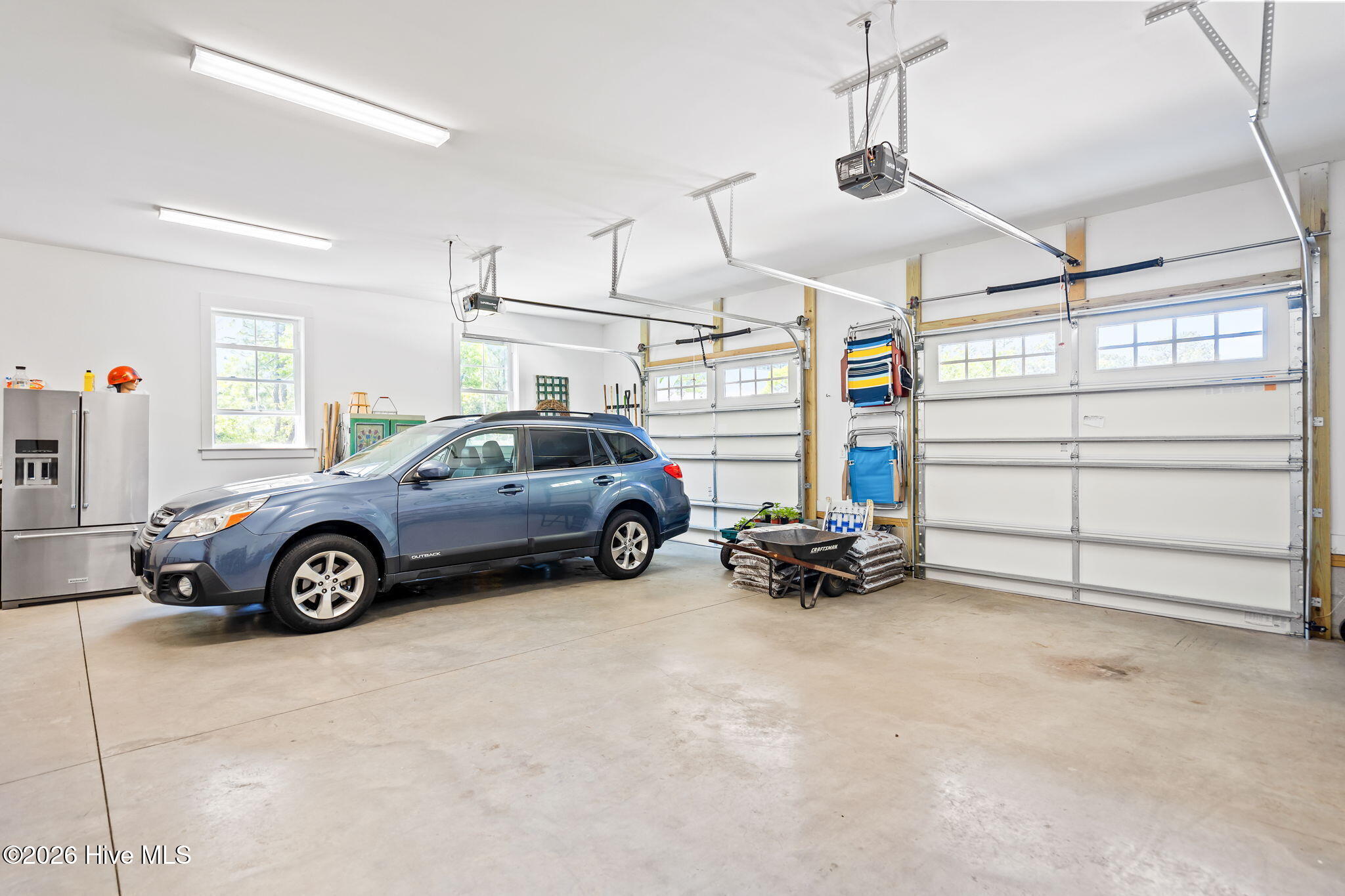 211 Whimbrel Way Hampstead, NC 28443 - Photo 62 of 99 Very spacious garage with large doors
