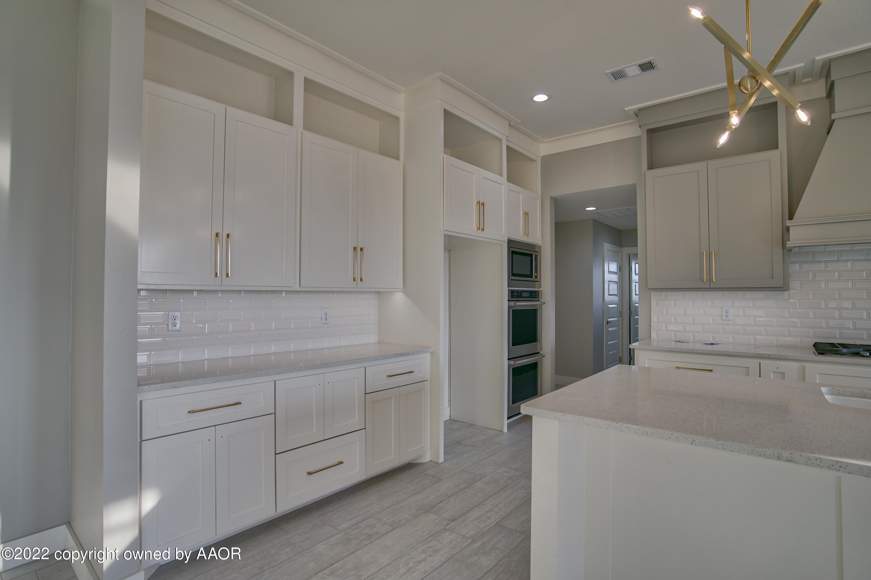 4200 Bobcat Springs Road Amarillo, TX 79119 - Photo 17 of 66 a kitchen with a sink and refrigerator