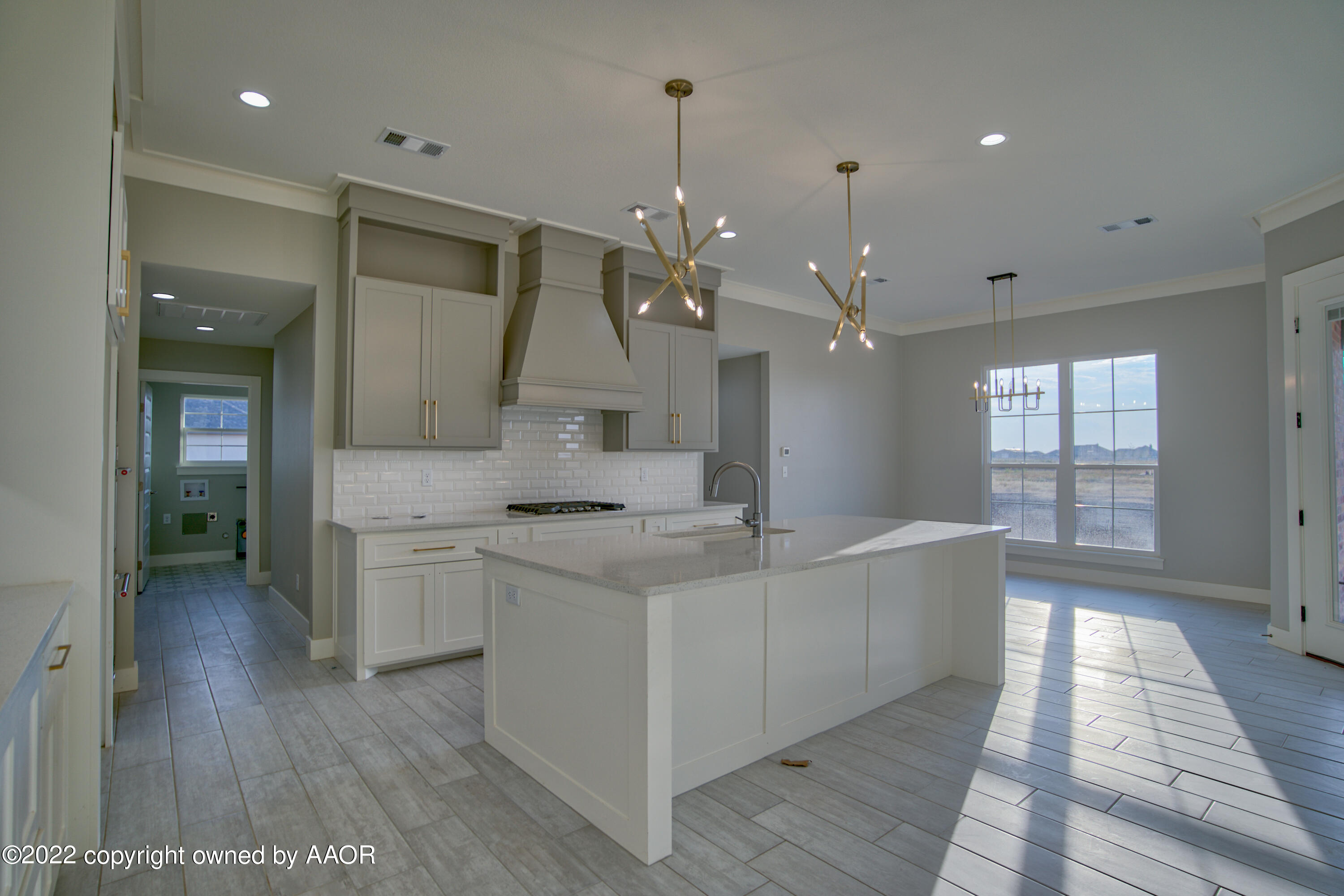 4200 Bobcat Springs Road Amarillo, TX 79119 - Photo 18 of 66 a large white kitchen with a sink a refrigerator and a stove