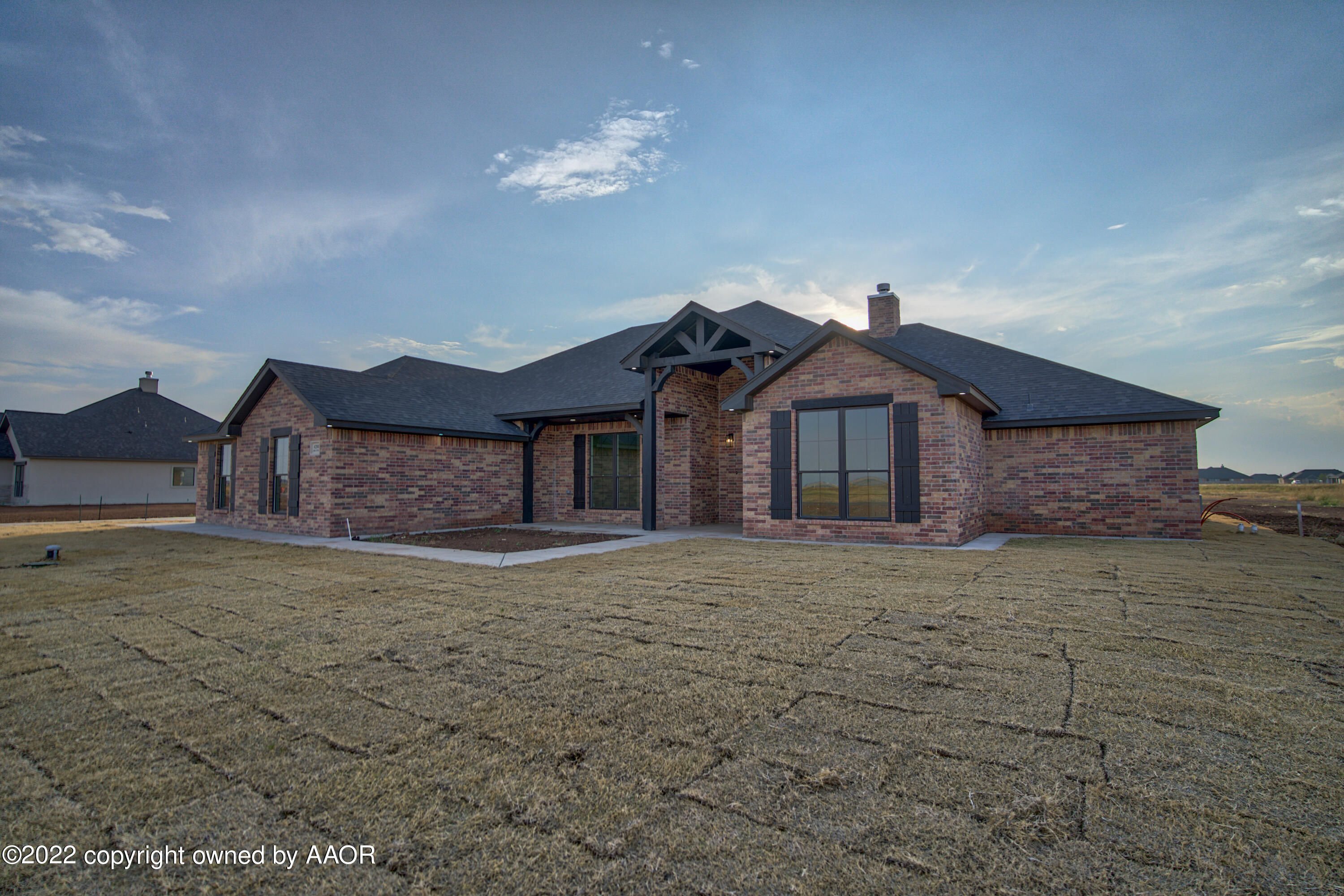 4200 Bobcat Springs Road Amarillo, TX 79119 - Photo 2 of 66 a front view of a house with a yard and garage