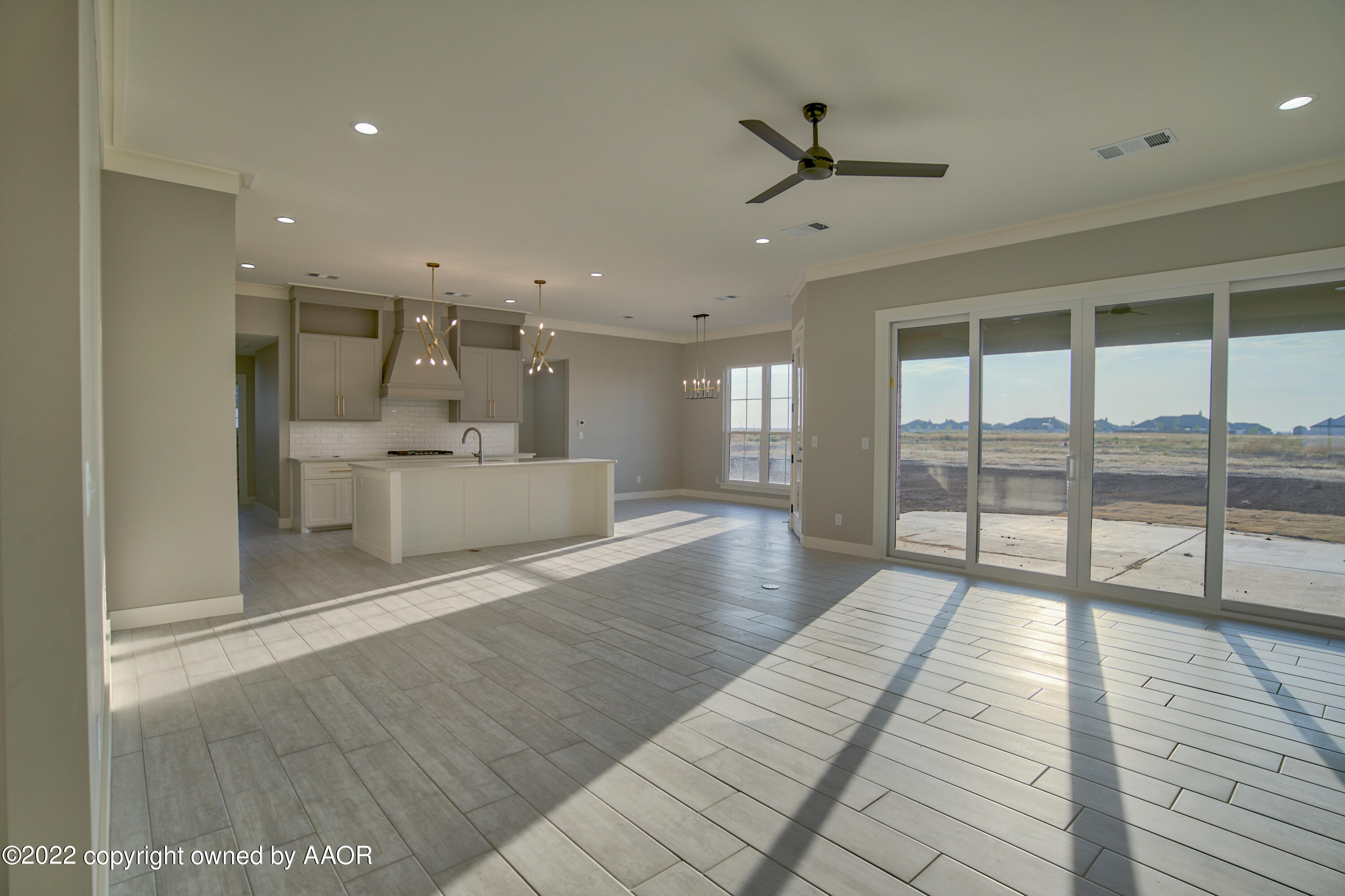 4200 Bobcat Springs Road Amarillo, TX 79119 - Photo 27 of 66 a view of a big room with wooden floor and windows