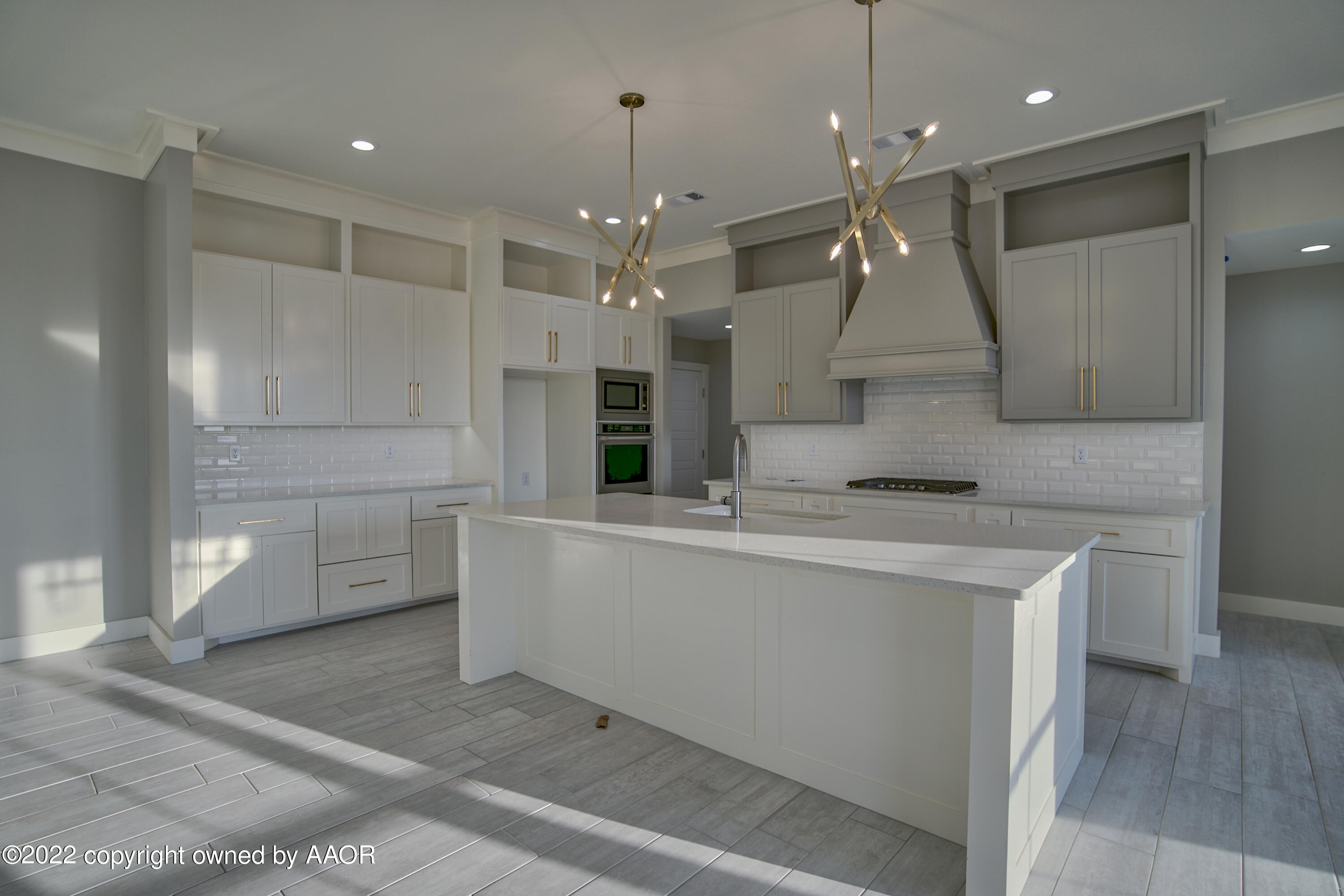 4200 Bobcat Springs Road Amarillo, TX 79119 - Photo 29 of 66 a large kitchen with kitchen island a sink stainless steel appliances and cabinets