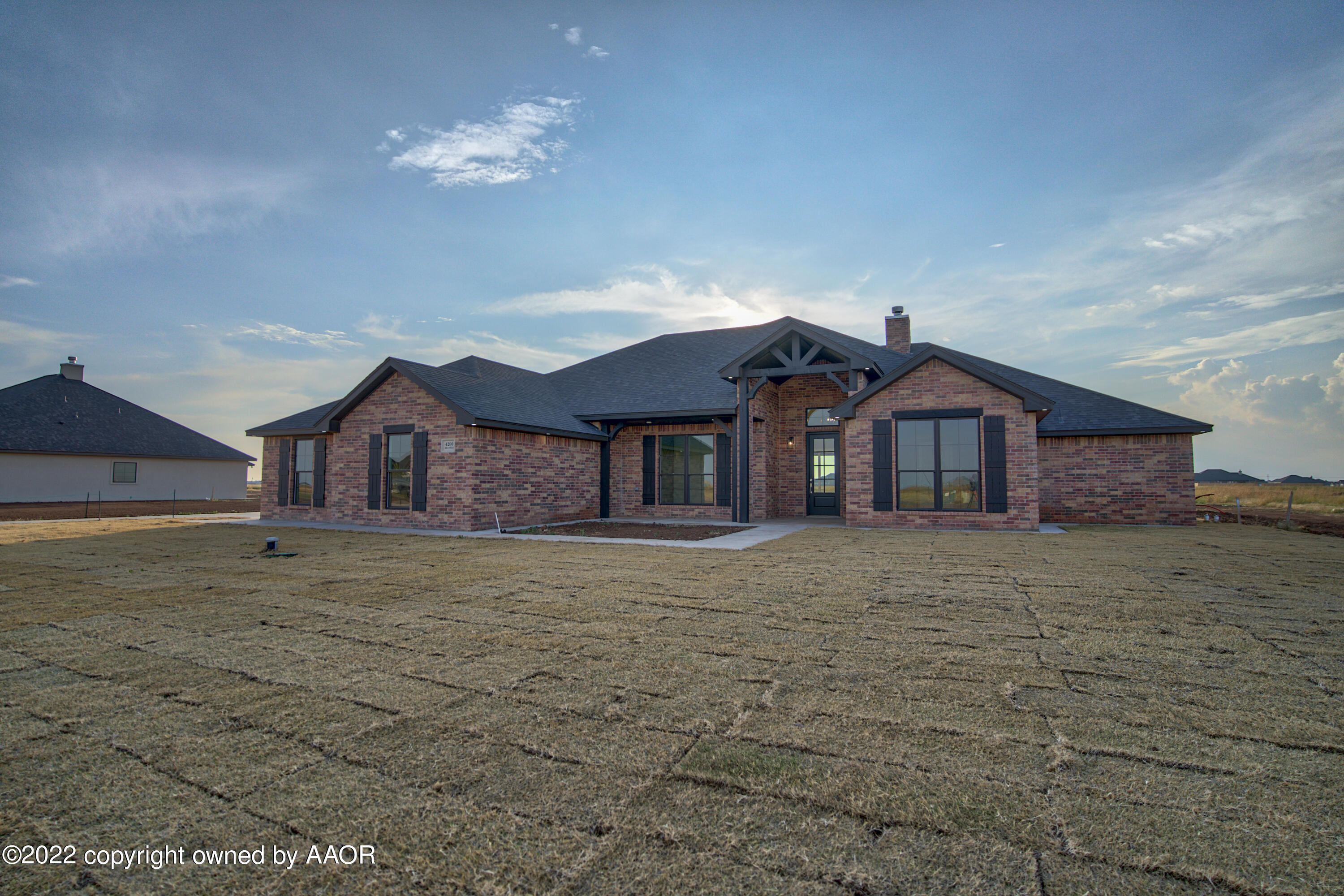 4200 Bobcat Springs Road Amarillo, TX 79119 - Photo 3 of 66 a front view of a house with a yard