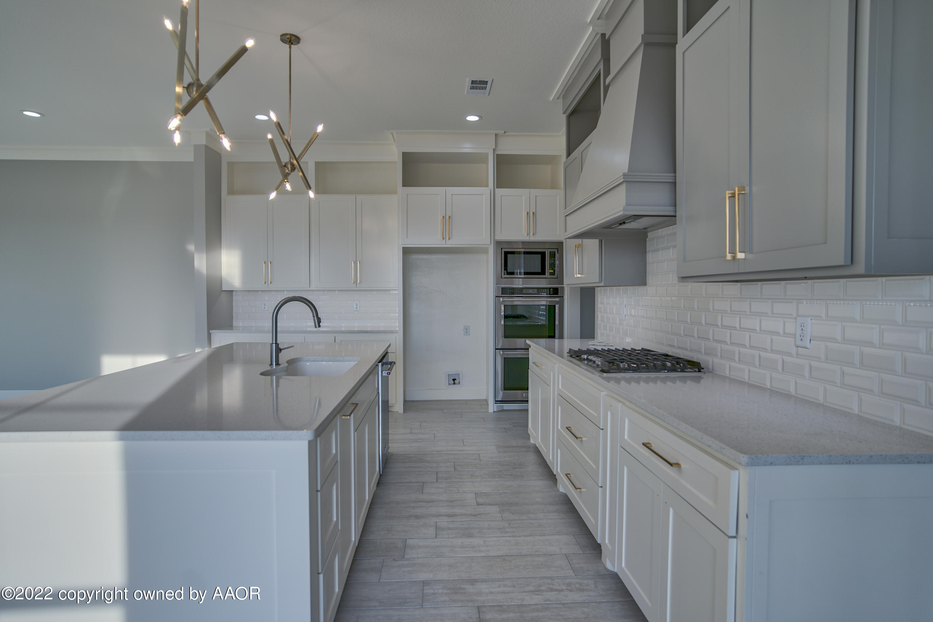4200 Bobcat Springs Road Amarillo, TX 79119 - Photo 31 of 66 a kitchen with stainless steel appliances granite countertop a sink and a stove top oven
