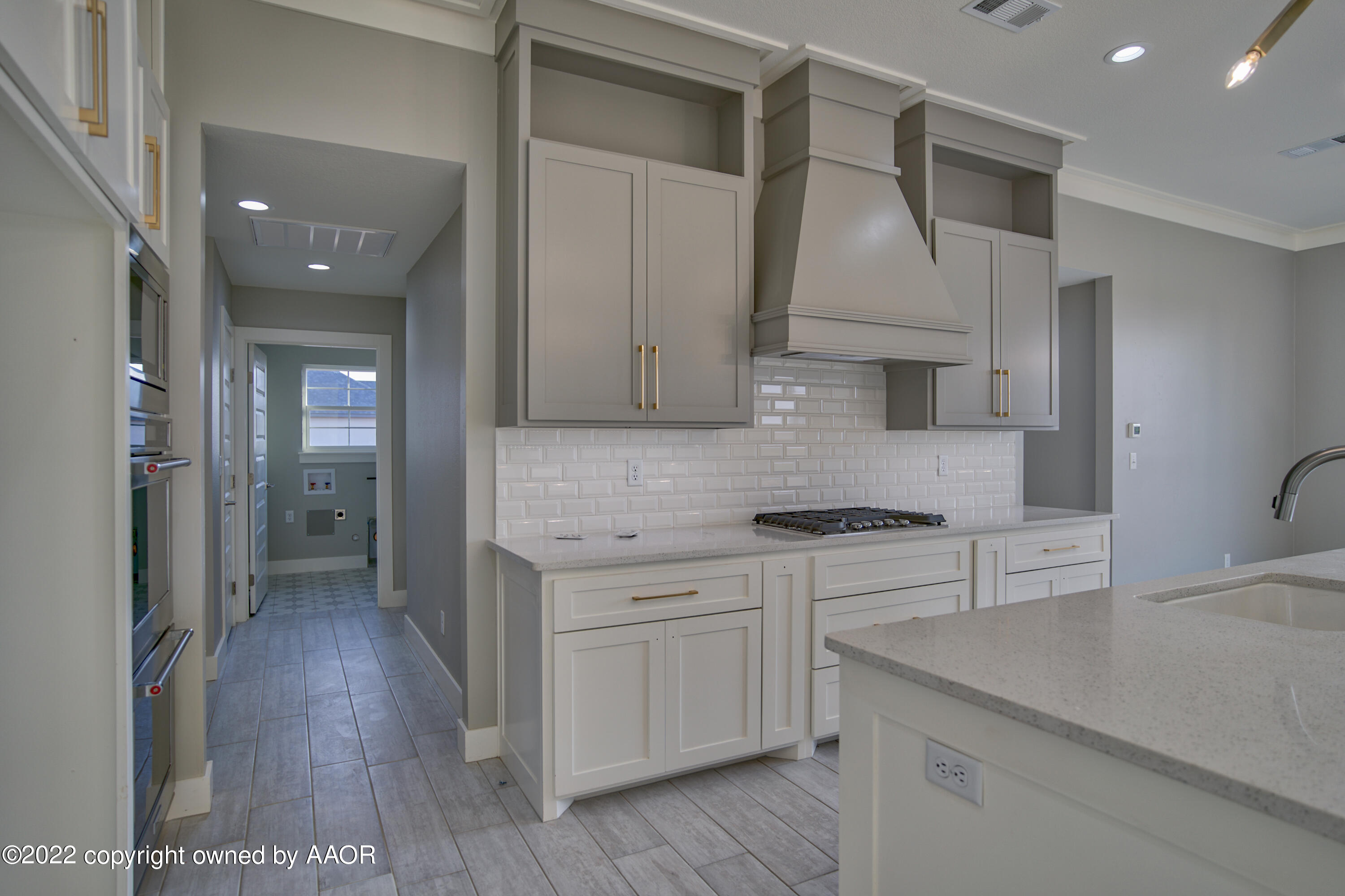 4200 Bobcat Springs Road Amarillo, TX 79119 - Photo 35 of 66 a kitchen with stainless steel appliances granite countertop a sink a stove and a refrigerator