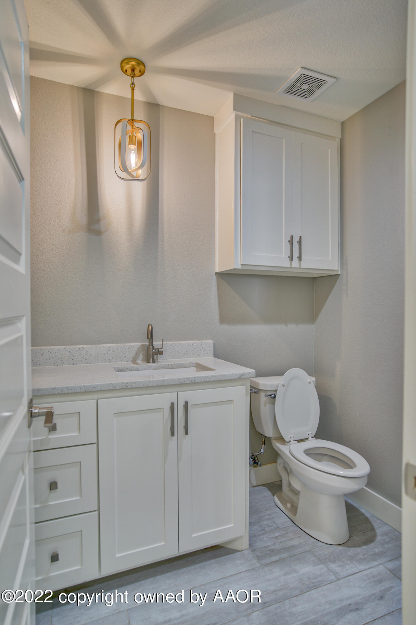 4200 Bobcat Springs Road Amarillo, TX 79119 - Photo 39 of 66 a bathroom with a toilet a sink and mirror