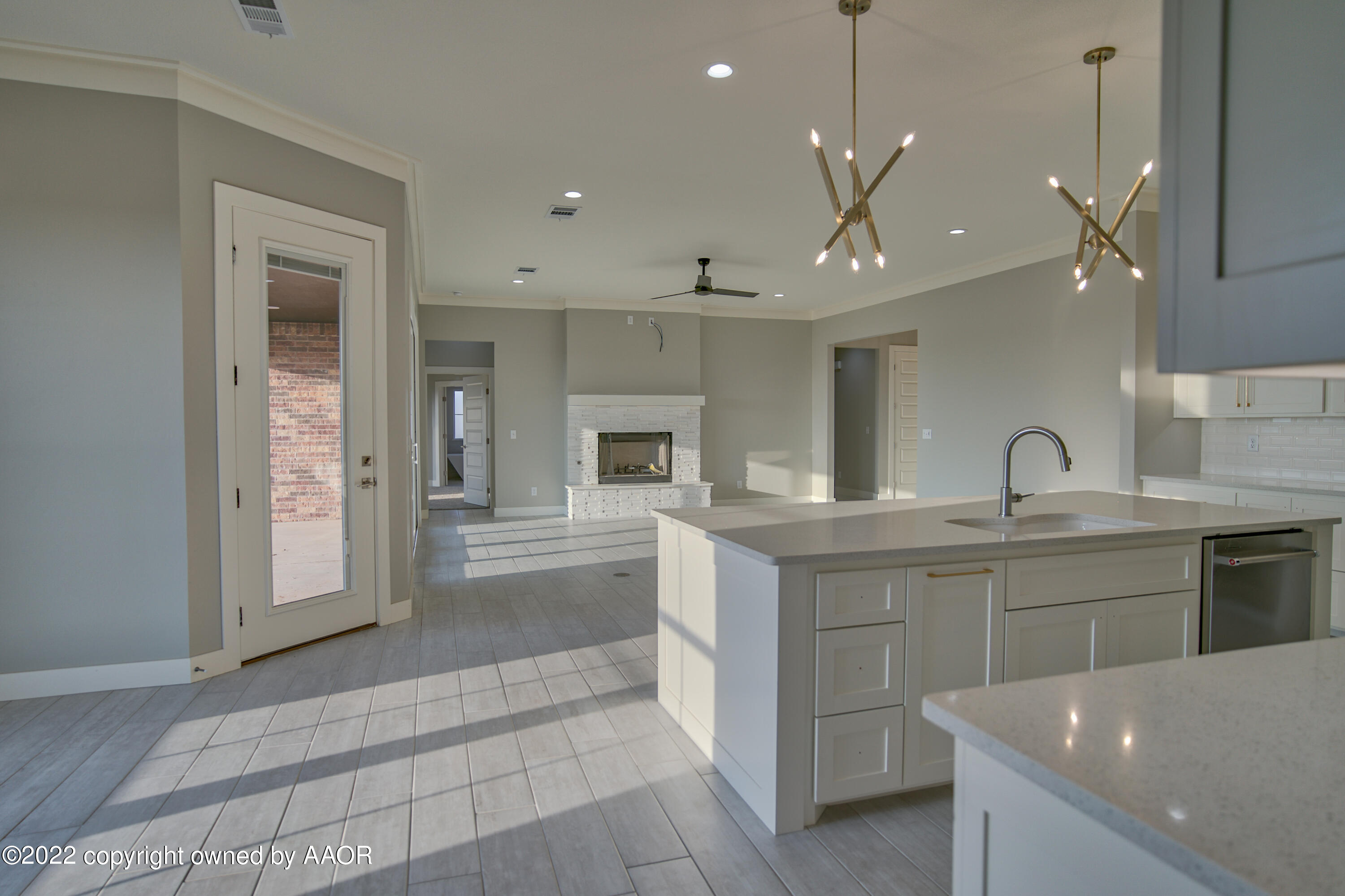 4200 Bobcat Springs Road Amarillo, TX 79119 - Photo 41 of 66 a large kitchen with kitchen island a sink stainless steel appliances and cabinets