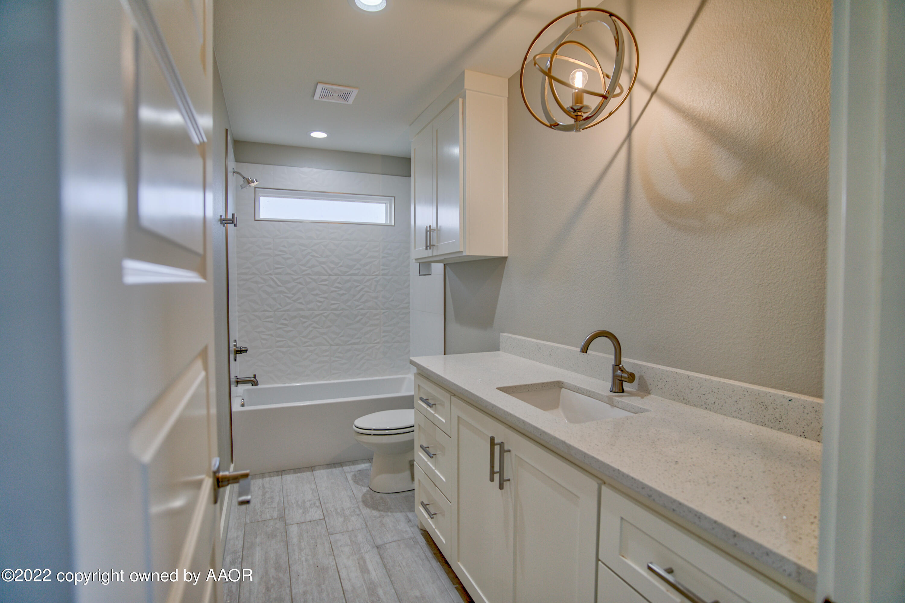 4200 Bobcat Springs Road Amarillo, TX 79119 - Photo 46 of 66 a bathroom with a toilet a sink and a shower