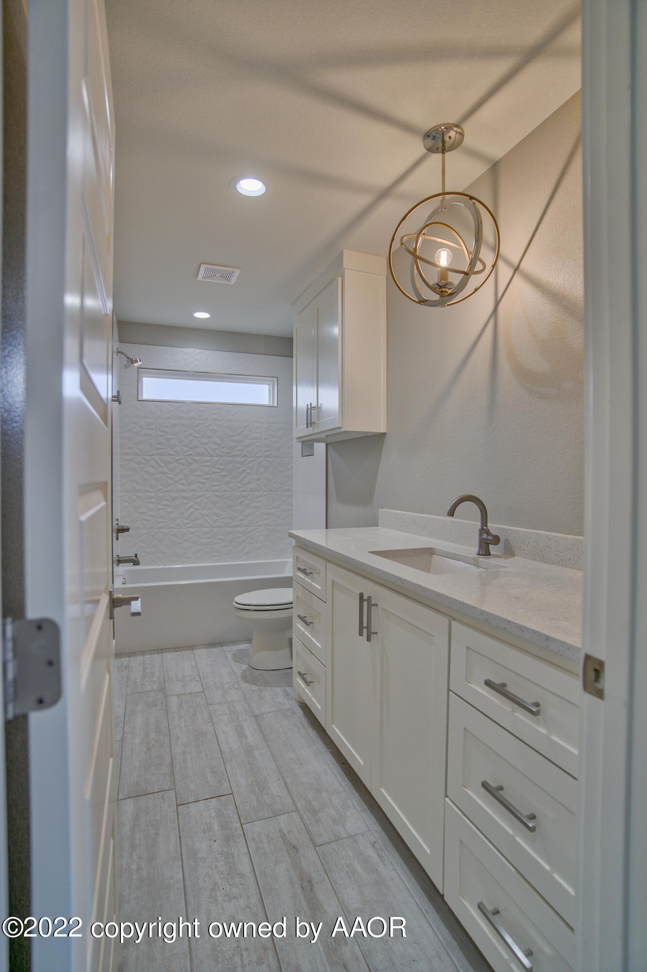 4200 Bobcat Springs Road Amarillo, TX 79119 - Photo 47 of 66 a bathroom with a sink a toilet and a large mirror