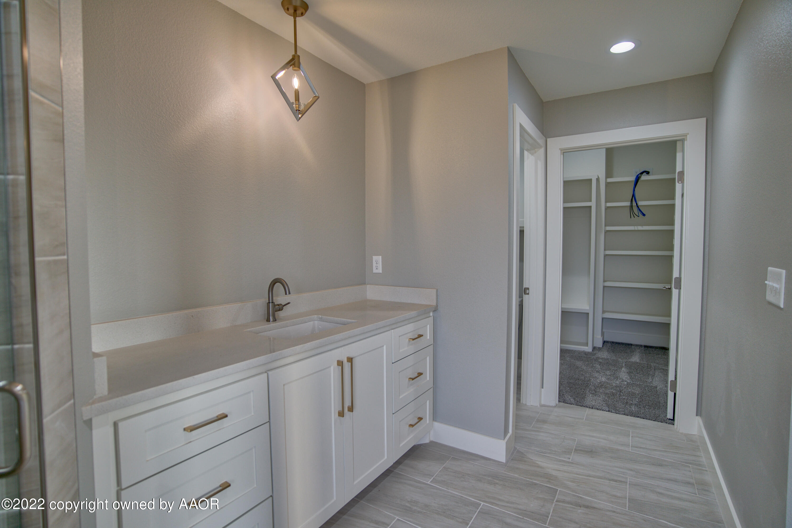 4200 Bobcat Springs Road Amarillo, TX 79119 - Photo 55 of 66 a kitchen with a sink and cabinets
