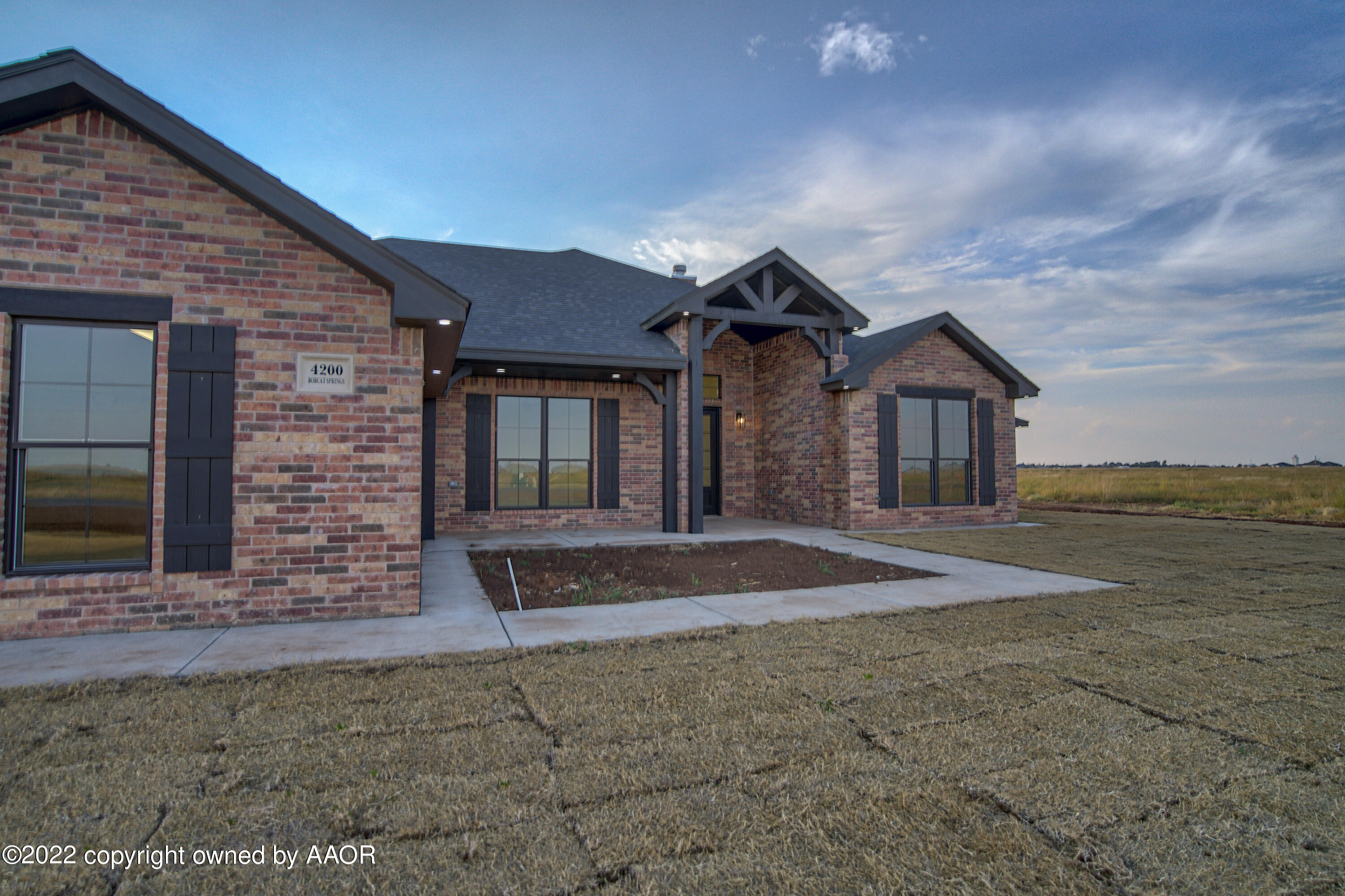 4200 Bobcat Springs Road Amarillo, TX 79119 - Photo 9 of 66 a front view of a house with a yard