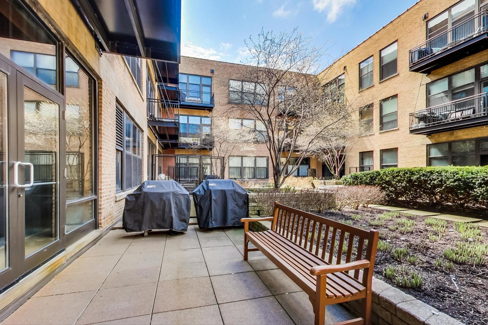 1040 West Adams Street, Unit 222 Chicago, IL 60607 - Photo 13 of 20 a view of a porch with furniture and next to a yard