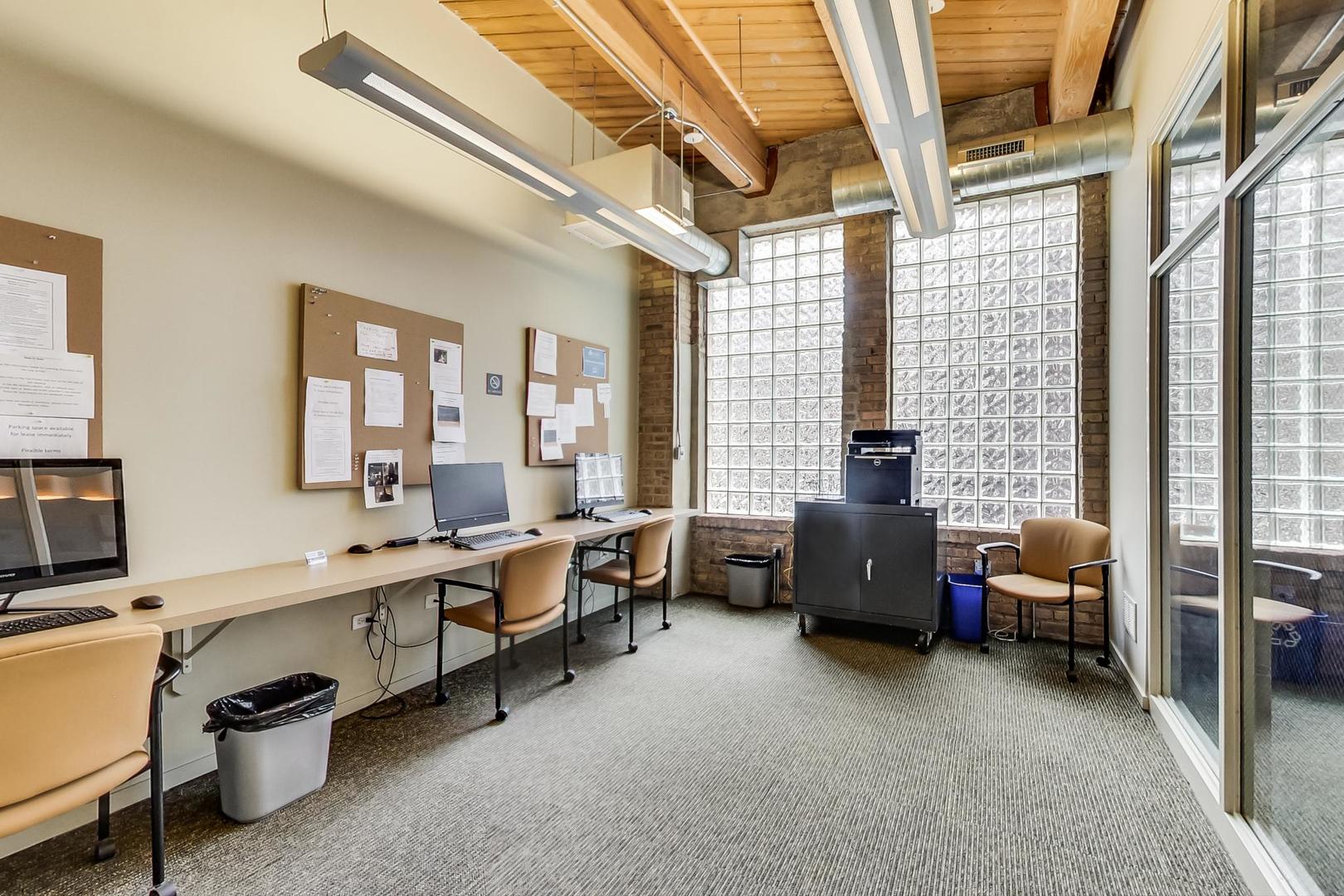 1040 West Adams Street, Unit 222 Chicago, IL 60607 - Photo 17 of 20 a living room with furniture window and a table