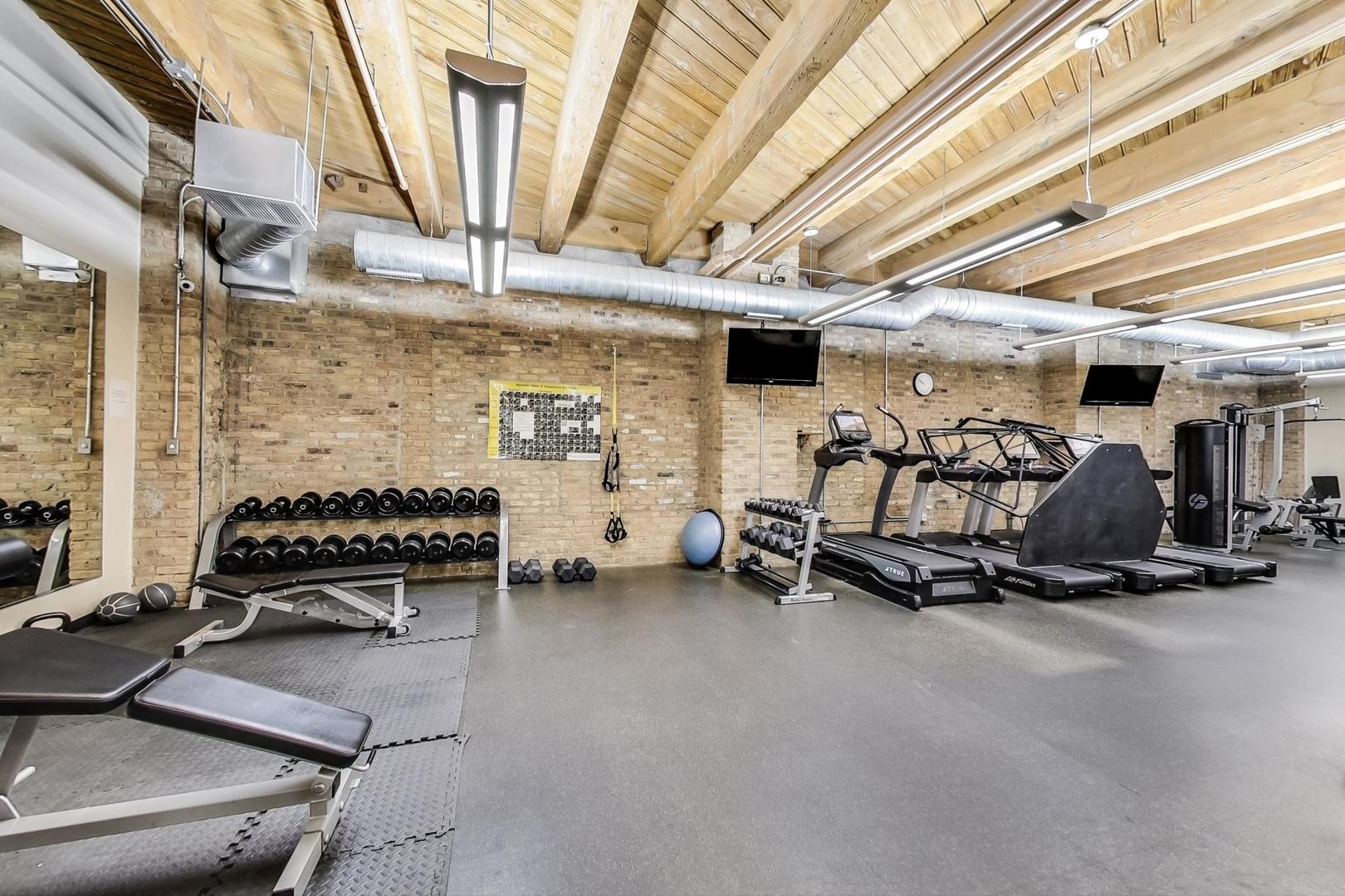 1040 West Adams Street, Unit 222 Chicago, IL 60607 - Photo 20 of 20 a view of a garage with cars