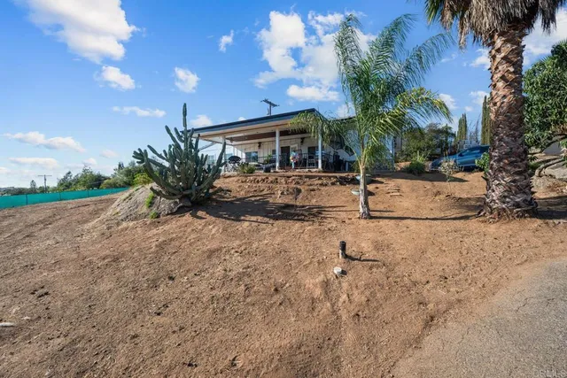 a view of swimming pool with outdoor seating and city view