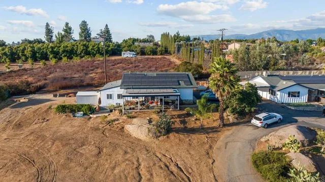 an aerial view of residential house and green space