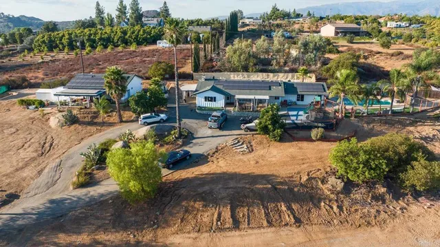 an aerial view of residential house and green space