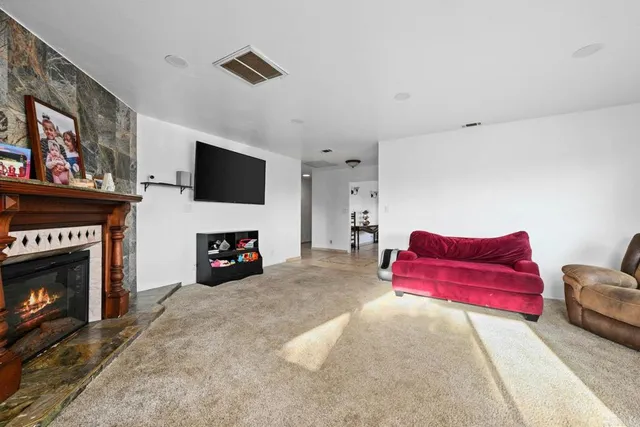 a bedroom with a bed and a fireplace