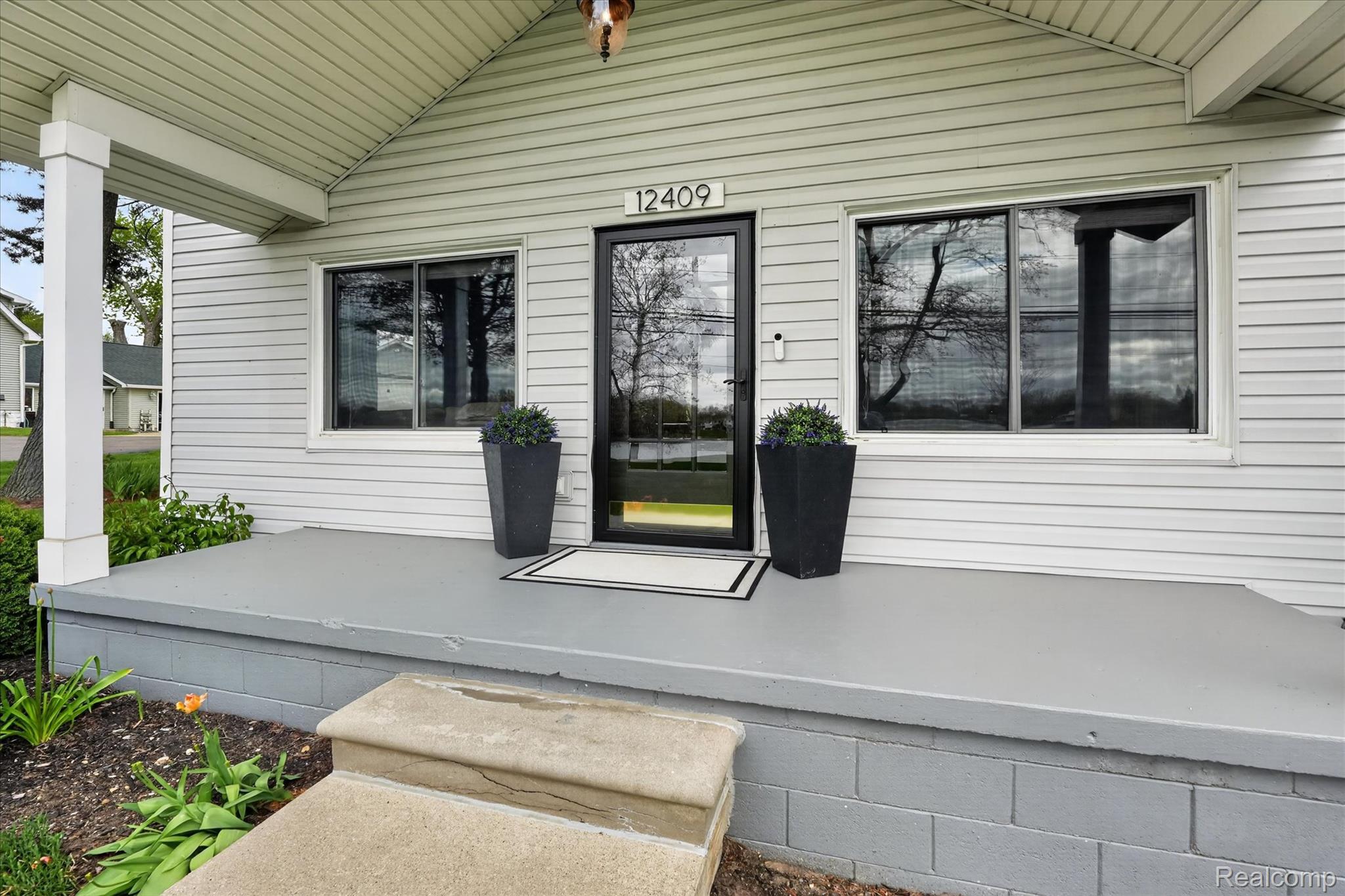 12409 Fenton Road Fenton, MI 48430 - Photo 55 of 61 Doorway to property featuring covered porch