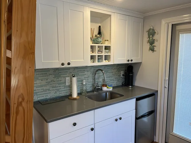 a living room with a fireplace and a window