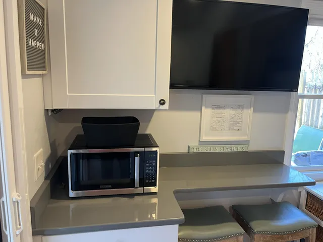 a view of a chairs and table on the deck