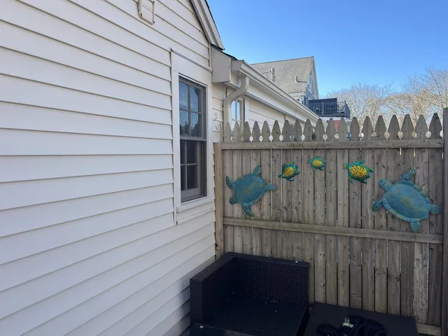 a view of a tree with an outdoor next to a building