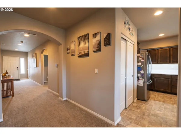 a living room with lots of furniture and a flat screen tv