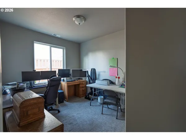 a workspace with furniture and window