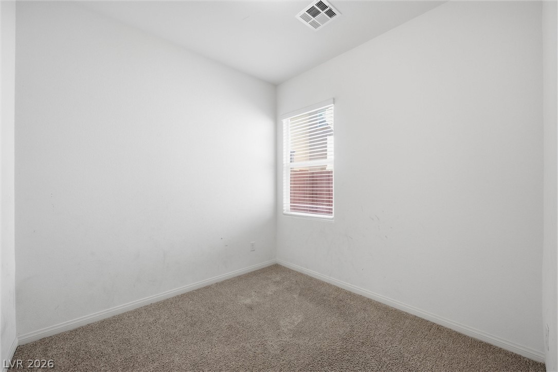 1811 Lincoln Road Las Vegas, NV 89115 - Photo 21 of 30 Carpeted spare room with baseboards