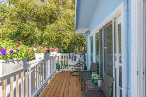 a view of balcony with furniture