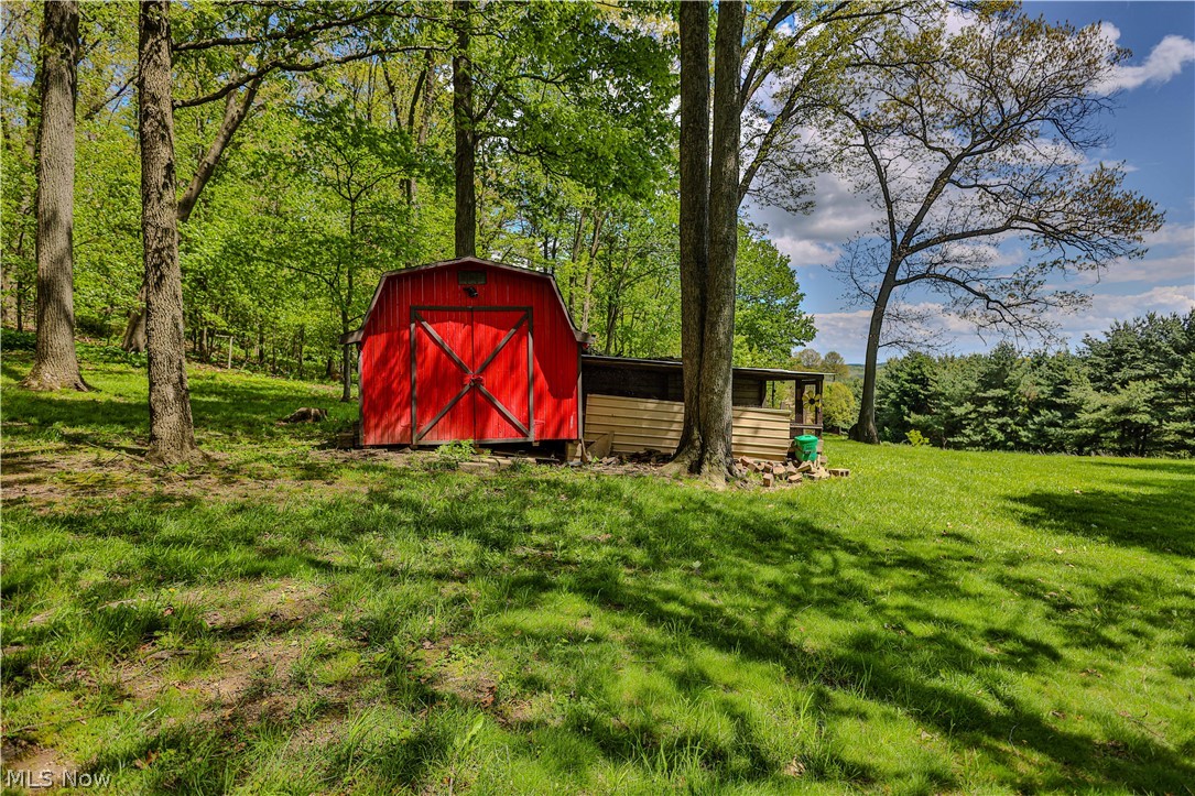 11154 Johnsford Road Southwest Beach City, OH 44608 - Photo 8 of 50 Red barn structure with a wood-clad lean-to