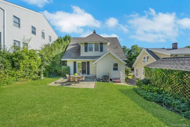 a view of a patio with table and chairs and potted plants